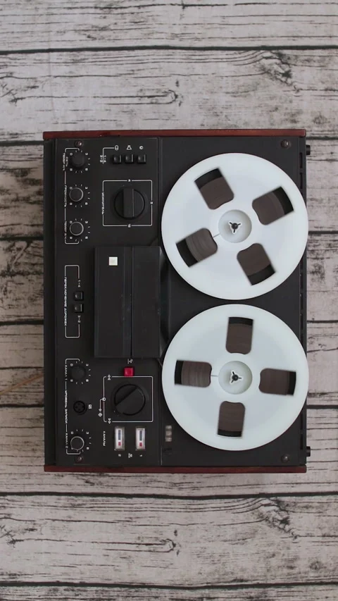 Man using Old portable reel to reel tape recorder. Concept of spying Stock Footage 274209953