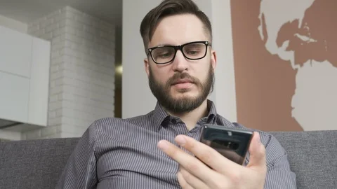 Man using online banking with smart phone and card 스톡 동영상 87307737