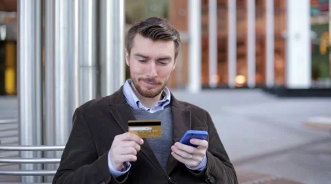 Man using online banking on smartphone with credit card (slider shot) Stock-Footage 68401974