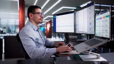 Man Using Online Document Management Software To Store Contracts Video stock 328394532