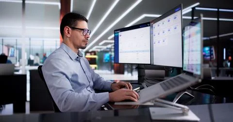 Man Using Online Document Management Software For Efficient Contract Storage. Stock Photos