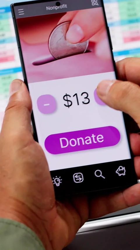 Man Using Online Money Donation Mobile Phone Video stock 283699241
