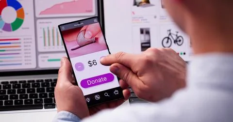Man Using Online Money Donation Mobile Phone Stock Photos
