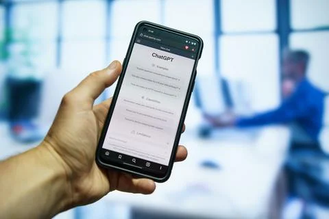 Man using Openai Chatgpt chatbot app at the office Stock Photos