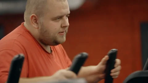 Man using orbitrek to warm up in gym Stock-Footage 108541269