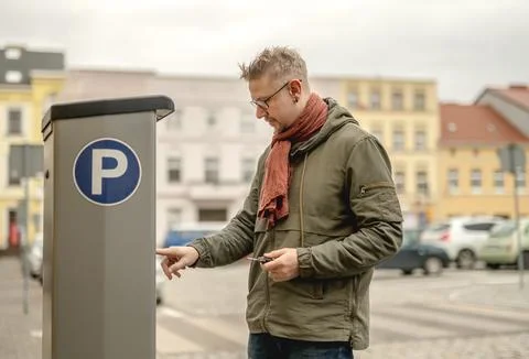 Man Using Parkin Meter On Parking Stock Photos