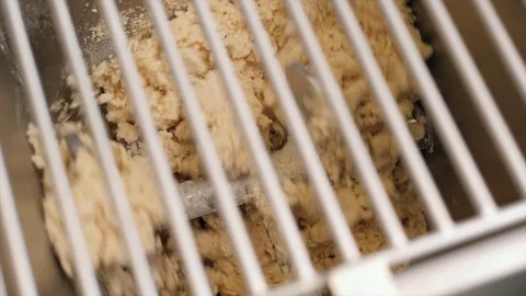 Man using pasta machine to prepare dough for tagliatelle, close up view, modern Stock Footage 77870365