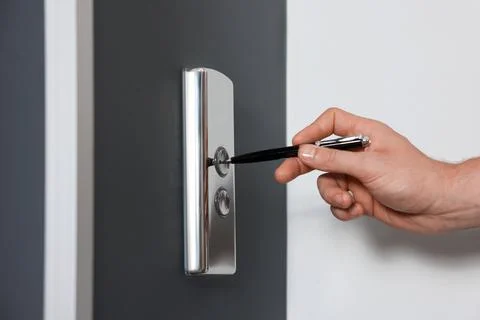 Man using pen to press elevator call button, closeup. Protective measure Foto stock