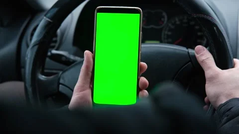 Man using phone with blank green background while driving Vídeo Stock 301864870