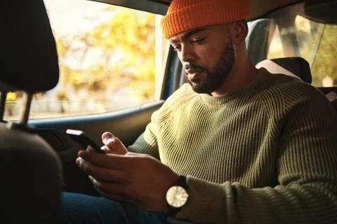 Man, using phone in car and social media, travel and transportation, navigation Stock Photos