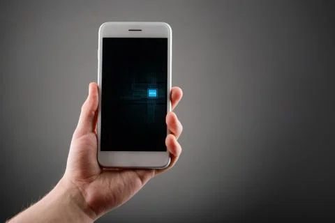 Man using a phone with embedded SIM card on gray background Stock Photos