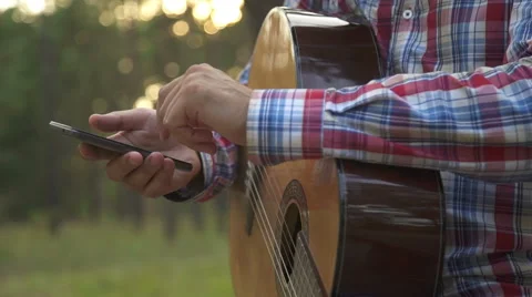 A man using a phone for entertainment Stock Footage 66883890