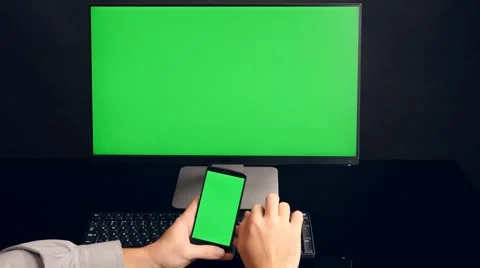Man using phone with green screen. PC green screen background. Ultra HD, 4K Stock Footage 44438955
