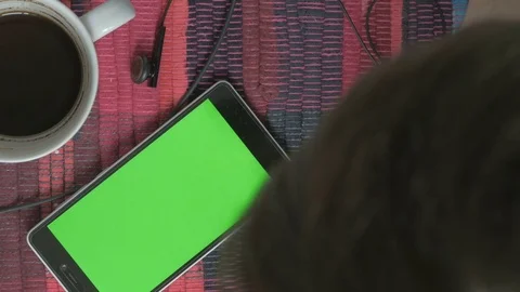 Man using phone with green screen. Shot on a digital camera in 4K, so you can Video stock 73977316
