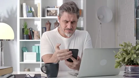 Man using phone at home Stock Footage 148023222