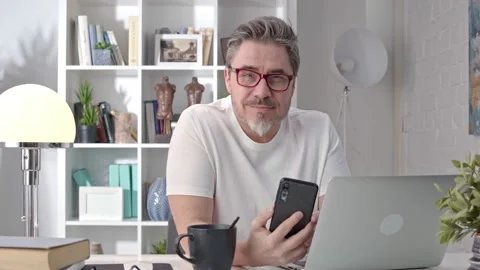 Man using phone at home Stock Footage 148023323