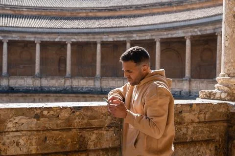 Man Using Phone Inside Alhambra Palace Stock Photos
