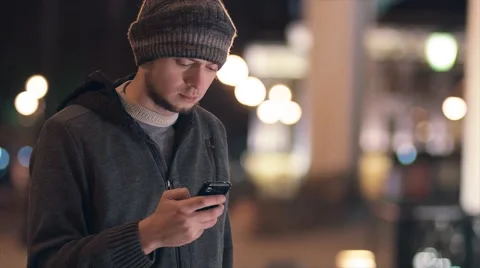 Man using phone at night outdoor Stock Footage 61864943