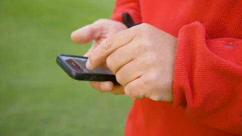 Man Using Phone With Red Sweater Vídeo Stock 127036014