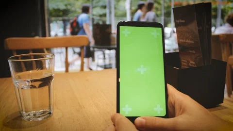 Man using phone on a restaurant Stock Footage 125373807