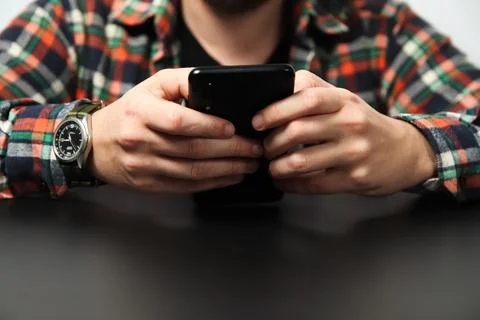 Man using phone, scrolling through social media, business context. Business.. 스톡 사진