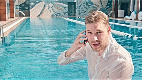 Man Using Phone By Swimming Pool 스톡 동영상 78417188