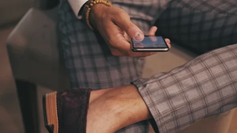 Man using phone while his staff is on the table Stock-Footage 96300450