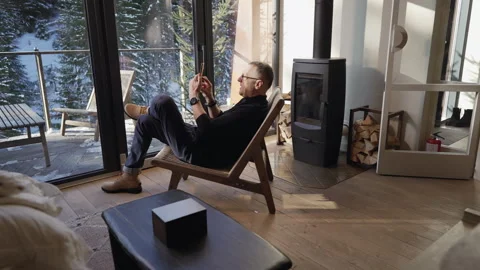 Man using phone while sitting in living room Stock-Footage 265103985
