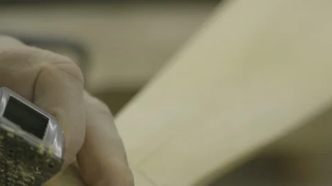 Man using plane on piece of wood Stock Footage 104868121