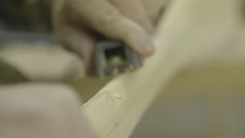Man using plane on wood for woodworking Stock Footage 104868171