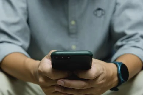Man using point finger on screen mobile smart phone.Business technology digit Stock Photos