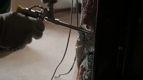 Man using polyurethane foam for installing new door Stock Footage 70913499
