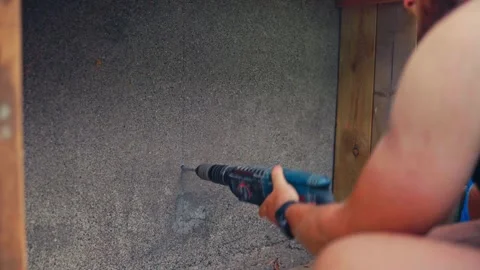 Man Using Power Drill To Drill Into A Surface - Close Up Stock Footage 333541018