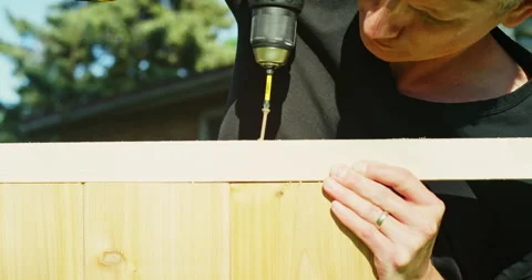 Man Using Power Tools Building Garden For Vegtables Stock Footage 277153156