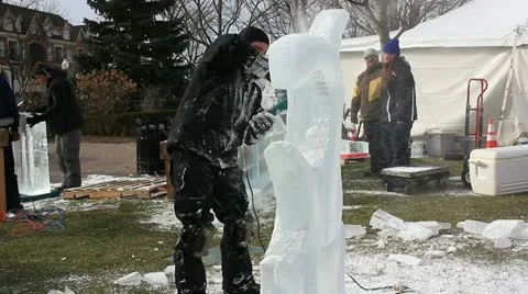 Man Using Power Tools to Sculpture Ice Figure Stock-Footage 20476416