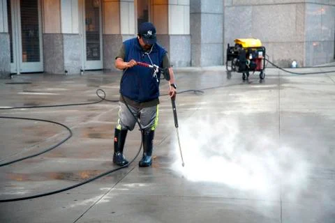 Man using pressure washer Stock Photos