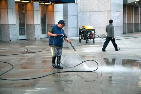 Man using pressure washer Stock Photos