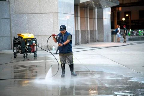 Man using pressure washer Stock Photos