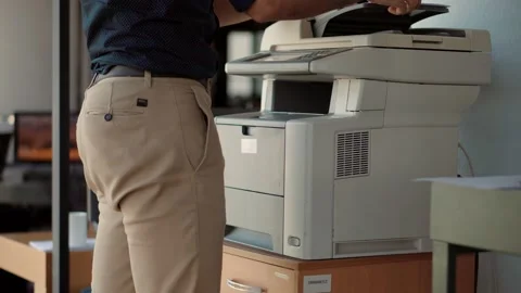 Man Using Printer Or Scanner In Office.Businessman Printing Document Stock Footage 132240092
