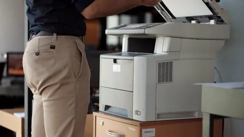 Man Using Printer Or Scanner In Office.Businessman Printing Document Stock Footage