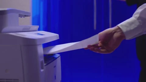 Man using printer or scanner and taking a document. Man open door and going out Stock Footage 148357645