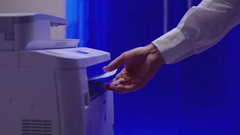 Man using printer or scanner and taking a document. Man open door and going out Stock Footage 148357656