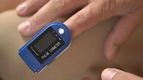 Man using a pulse oximeter Stock Footage 159297926