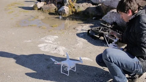 Man using quadcopter Stock Footage 86510673