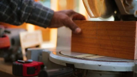 Man using a radial arm saw Видео 88404879