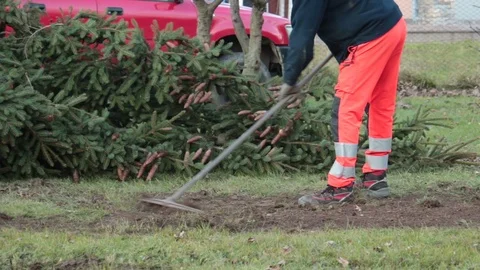 Man using rake Stock Footage 100428277
