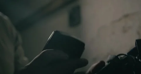 Man Using Retro Walkie Talkie for Communication Inside Wartime Bunker Stock Footage 344348112