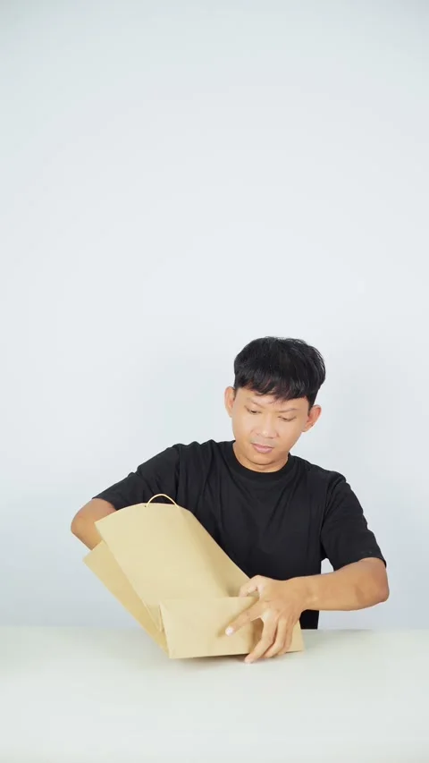 Man Using Reusable Shopping Bag on White Background Video stock 347105307