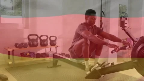 Man using rowing machine performing strokes in gym, initiating drive by pushing Stock Footage 333719912
