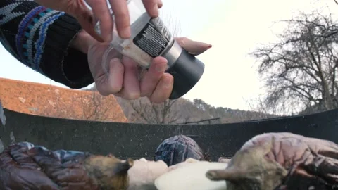 Man using Salt Grinder on Vegetables Barbecue, Medieval Citadel in Backgroun Stock Footage 149893193